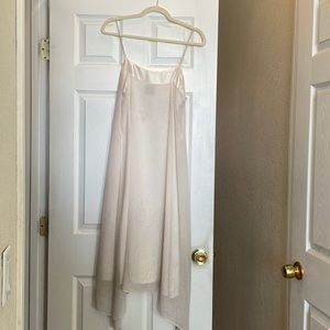 Beautiful 100% silk, ivory with delicate designs on the silk, soft as a caress